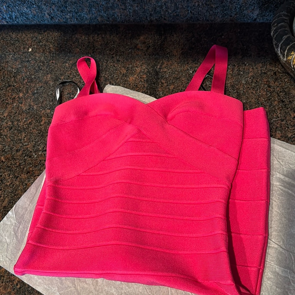 Herve Leger bandage dress in hot pink.
